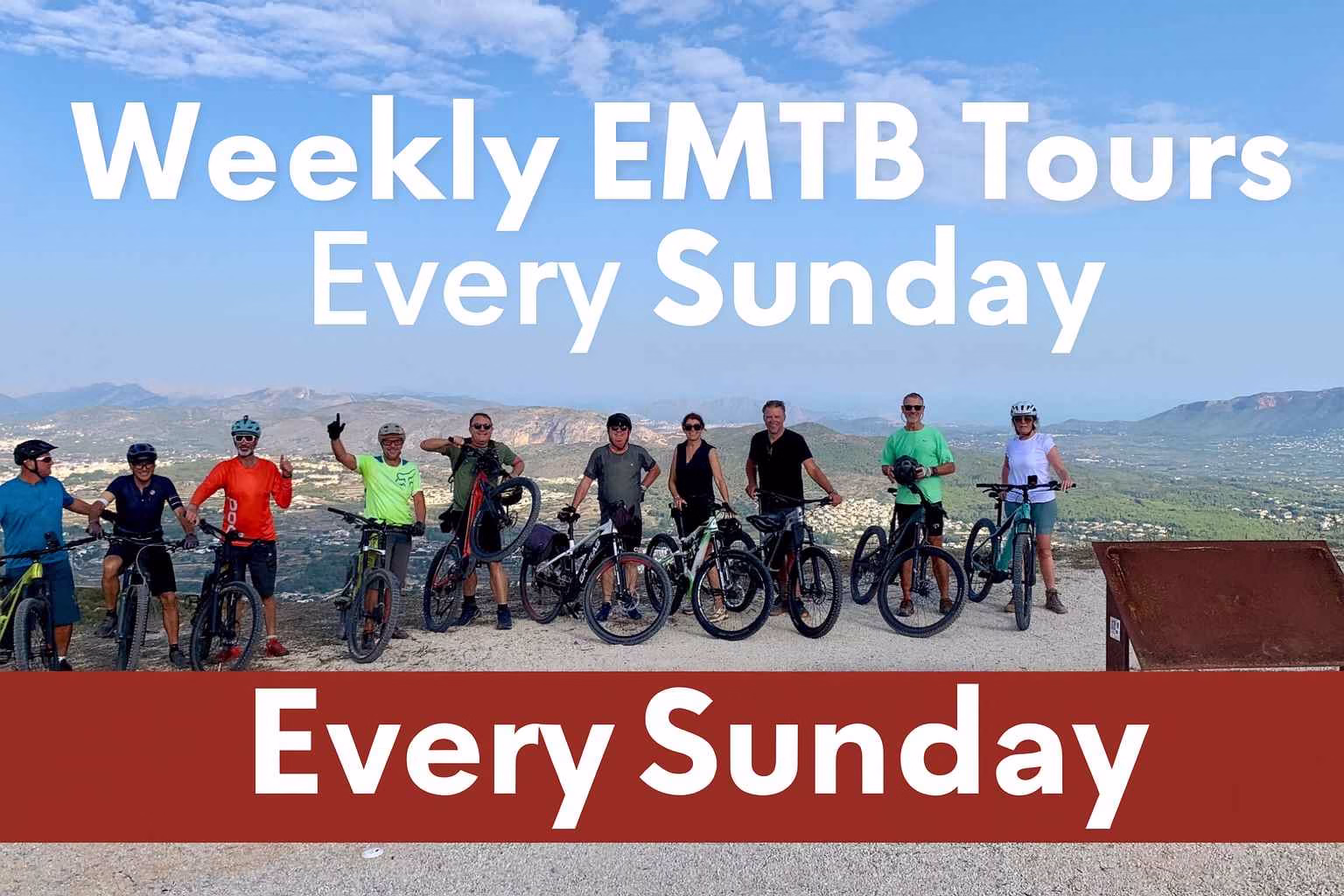 Group of cyclists on Elite Bikes weekly E-MTB tour in Jávea, enjoying scenic mountain views every Sunday.
