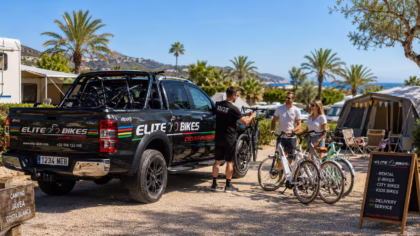 Elite Bikes Ford Ranger delivering rental bikes to campers at a sunny campsite in Jávea, Costa Blanca